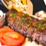 Casado con carne en salsa, tomate y papas